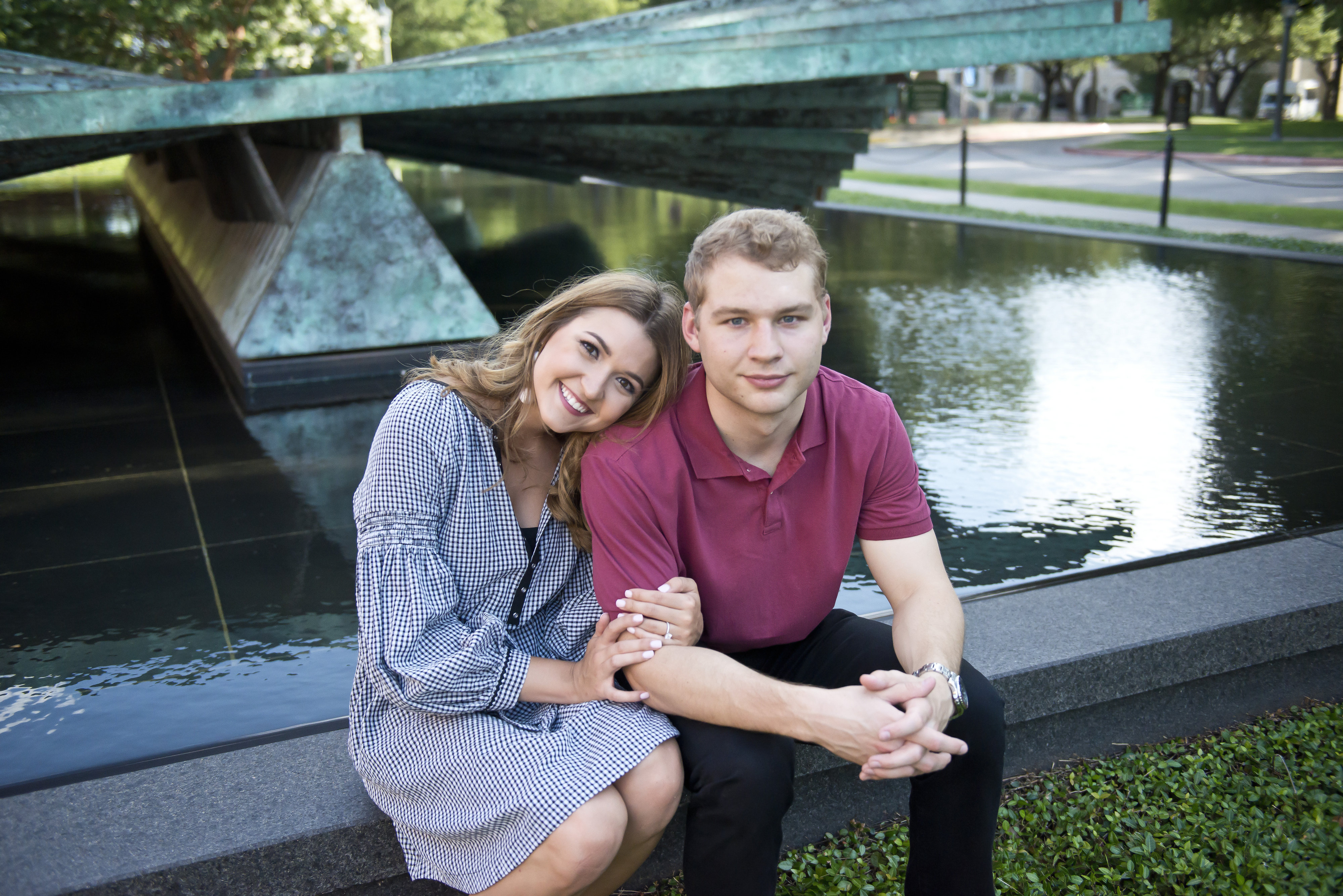 Couple Near Water Sculpture Sitting