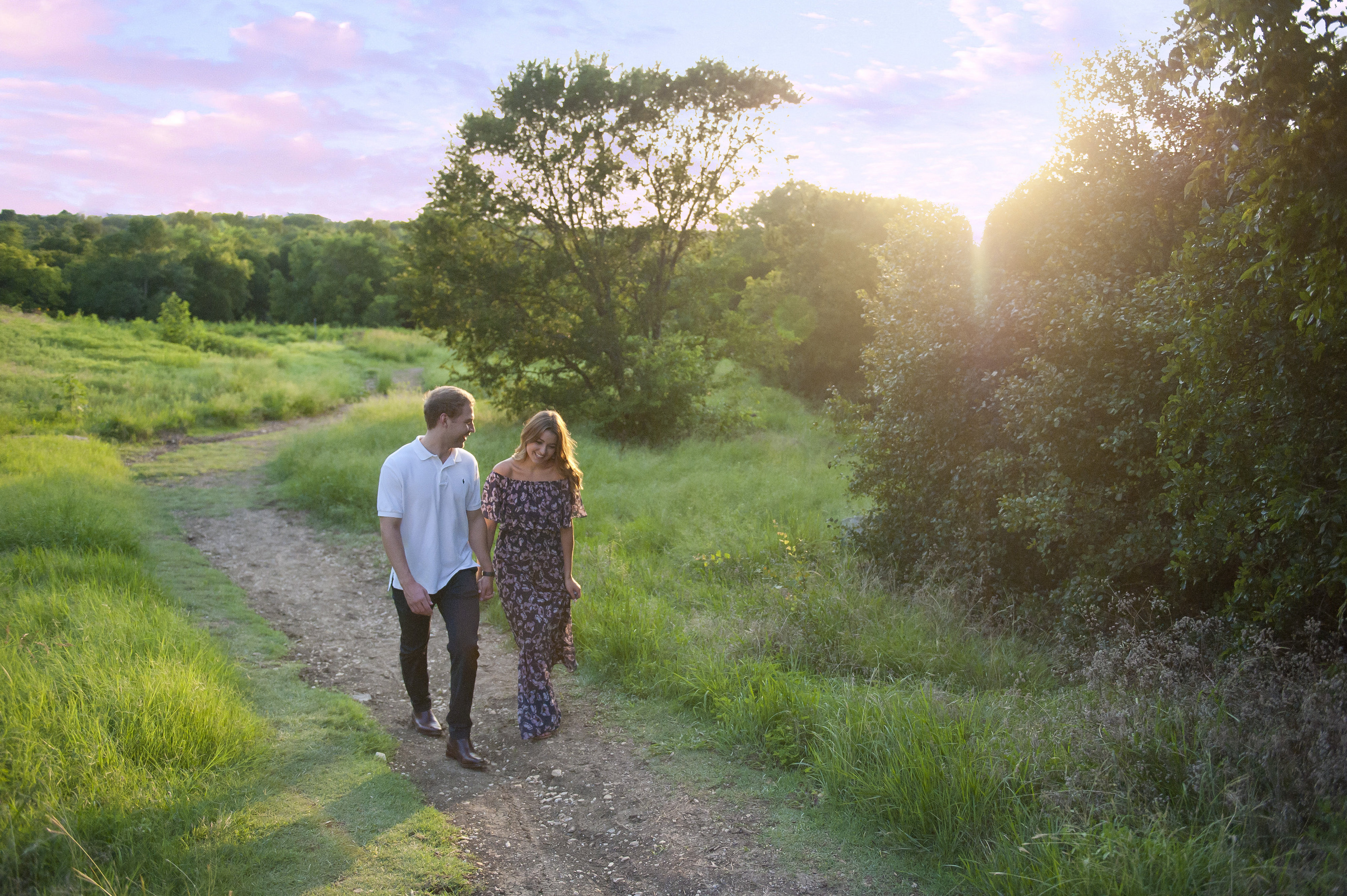 Couple Walking at Sunset Along a Path