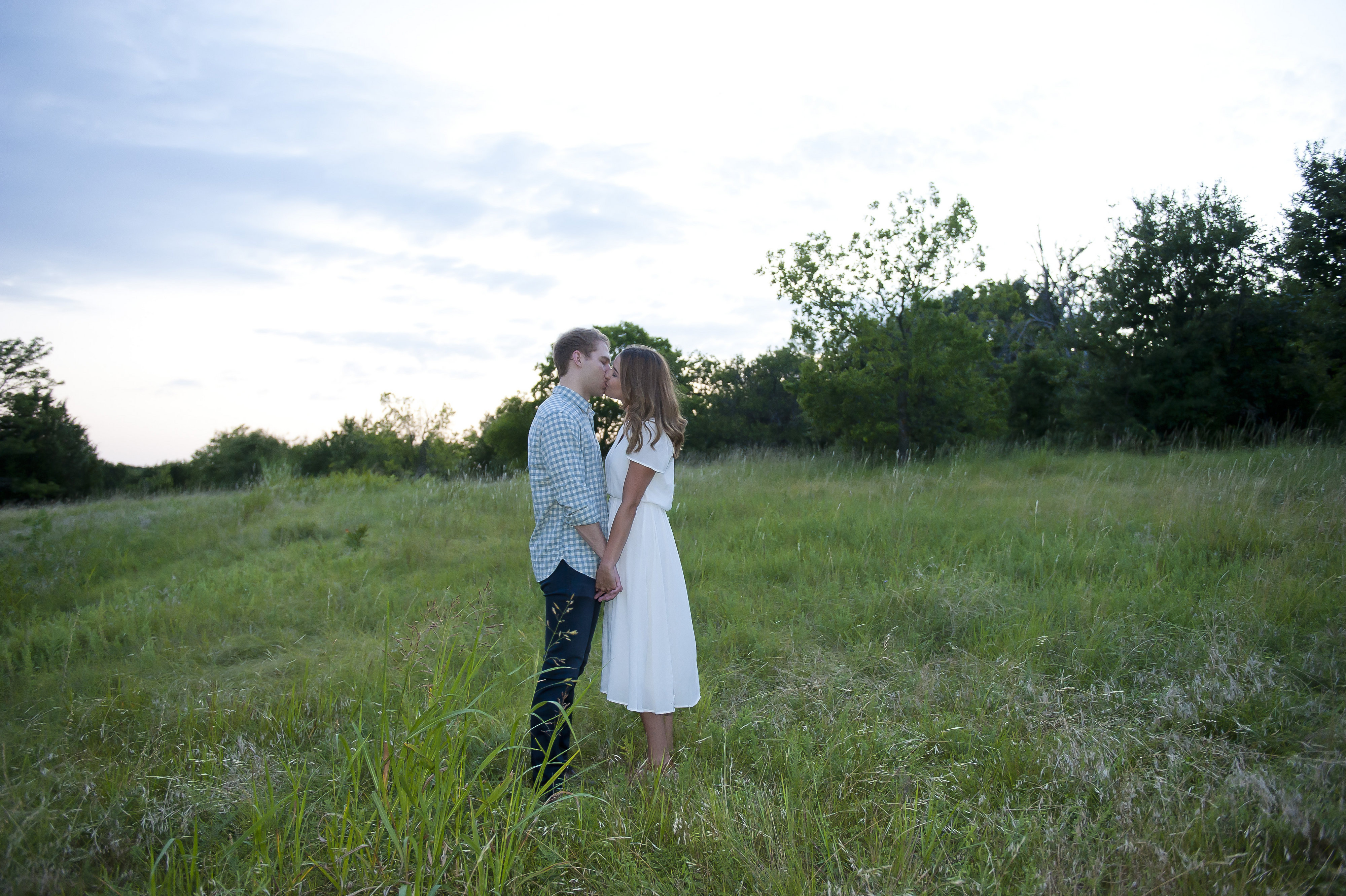 Couple Kissing in a Field