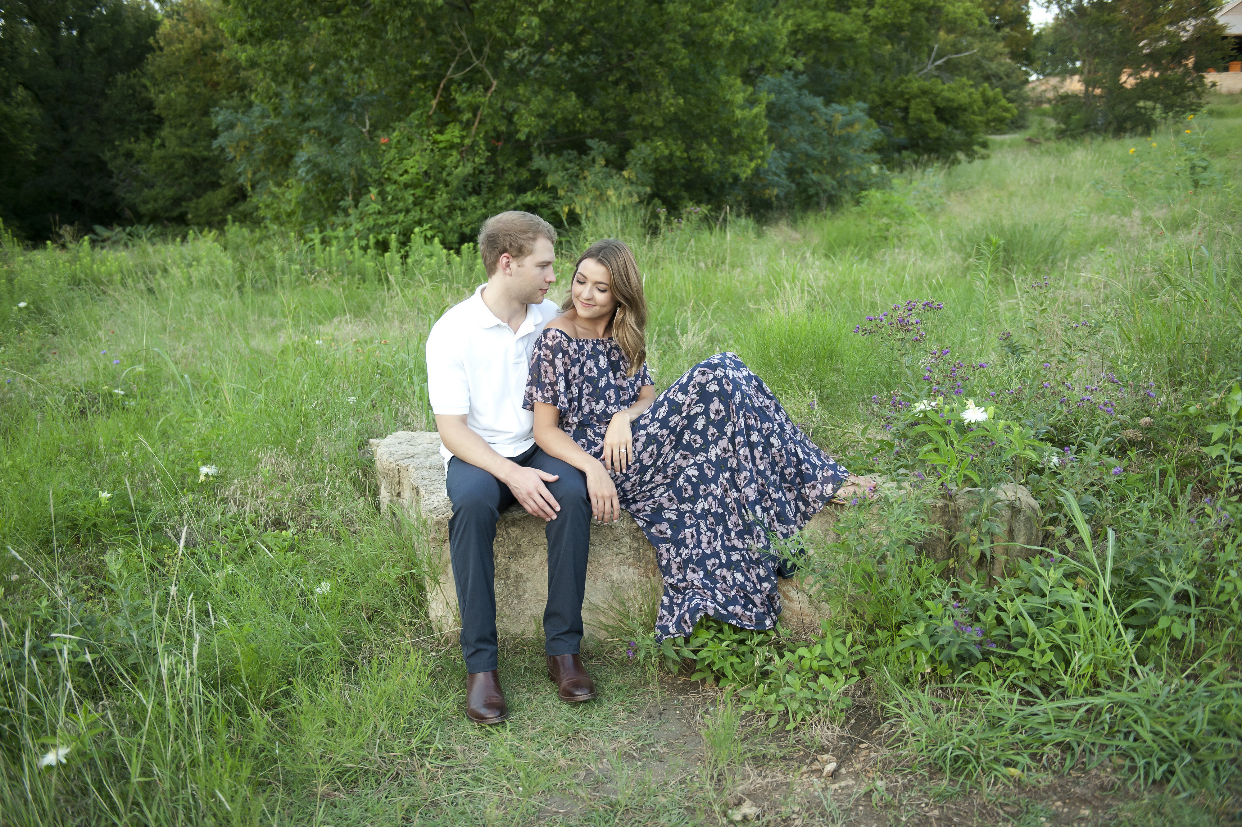 Couple Relaxing on a Stone